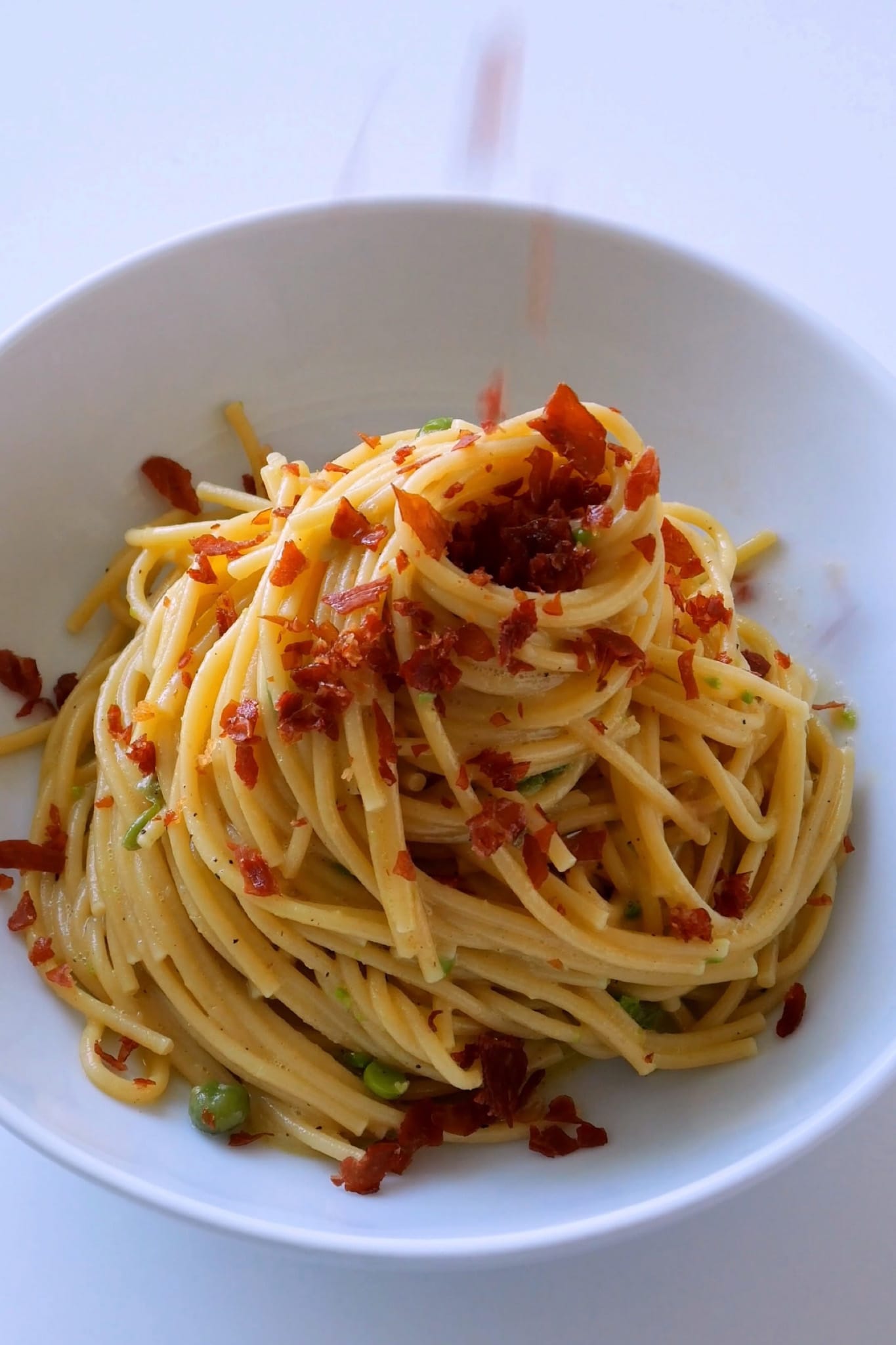 Smashed Spring Pea Spaghetti Carbonara with Prosciutto Crumbs